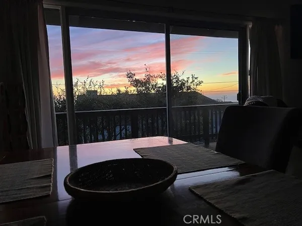 a view of balcony with wooden floor and fence