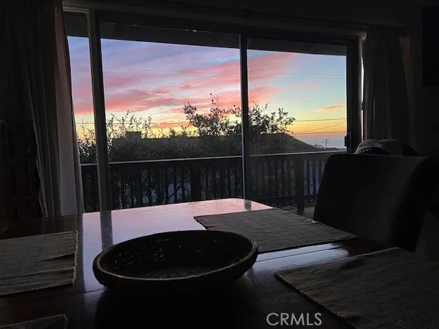 a view of balcony with wooden floor and fence