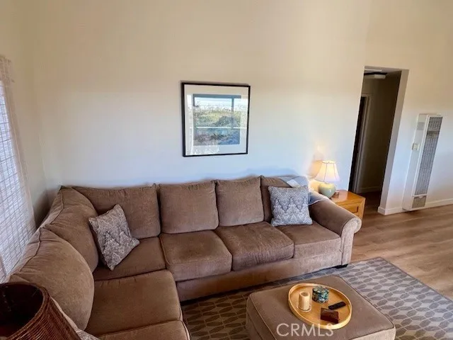 a view of balcony with wooden floor and fence