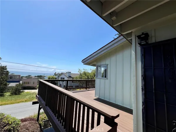 a kitchen with a sink stainless steel appliances cabinets and a window