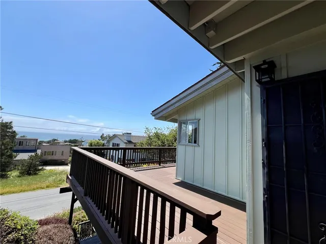 a kitchen with a sink stainless steel appliances cabinets and a window