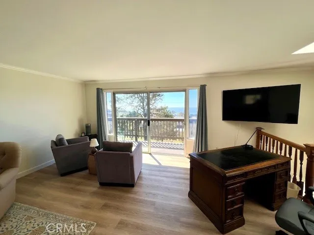 a bathroom with a sink a toilet a mirror and a window