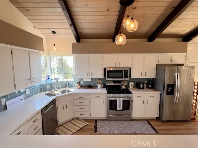 a living room with furniture flat screen tv and a fireplace