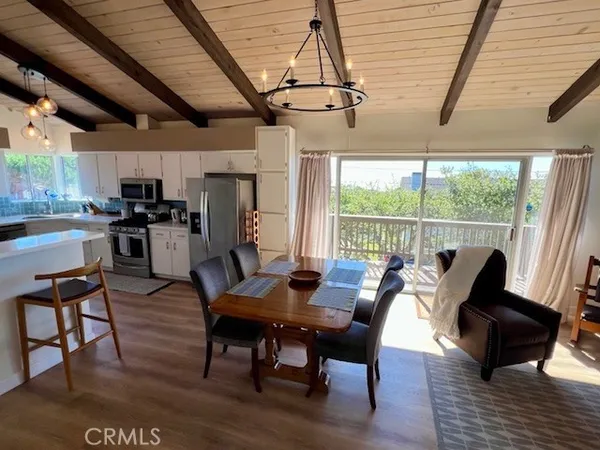 a view of balcony with wooden floor