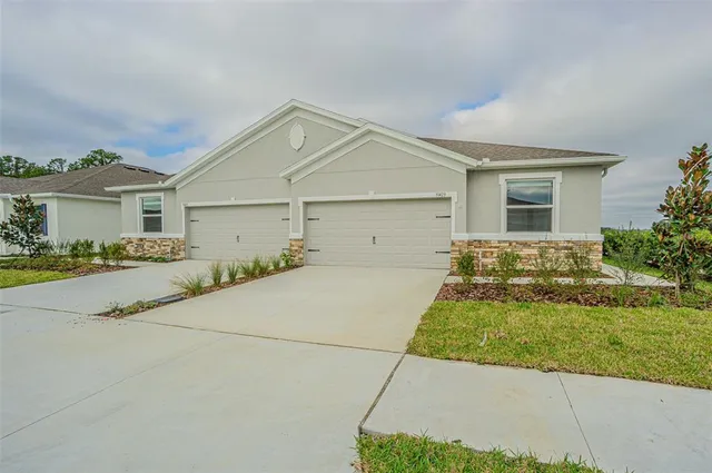a view of garage and yard