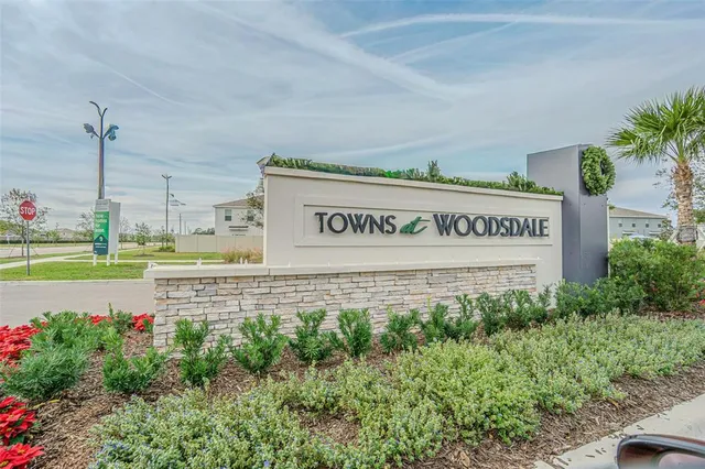 an aerial view of a house with a swimming pool