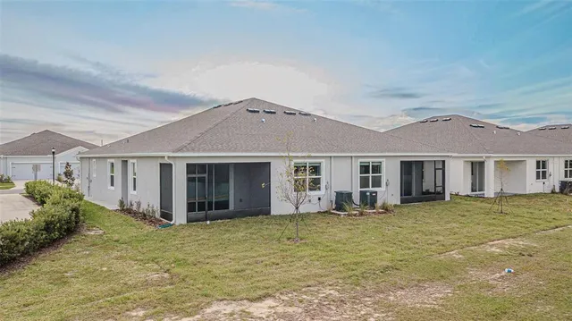 an aerial view of a house with a swimming pool