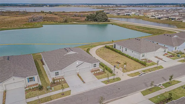 a view of a swimming pool with a lake view