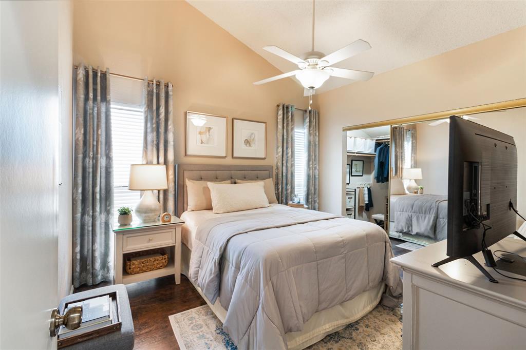 17490 Meandering Way, Unit 804 Dallas, TX 75252 - Photo 11 of 33 a bedroom with a bed and a mirror on the dresser