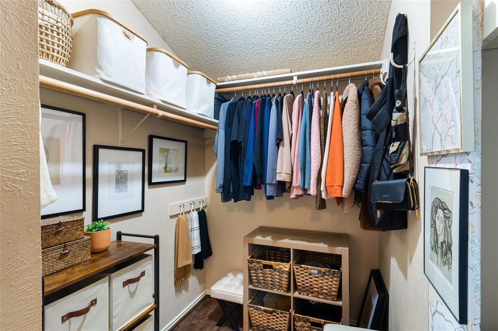 17490 Meandering Way, Unit 804 Dallas, TX 75252 - Photo 13 of 33 a view of walk in closet with clothes and shoes