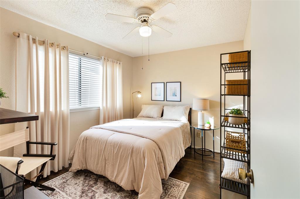 17490 Meandering Way, Unit 804 Dallas, TX 75252 - Photo 15 of 33 a bedroom with a bed and wooden floor