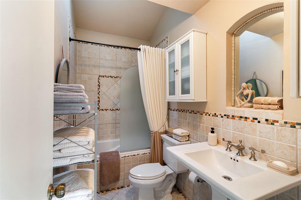 17490 Meandering Way, Unit 804 Dallas, TX 75252 - Photo 17 of 33 a bathroom with a sink toilet and shower
