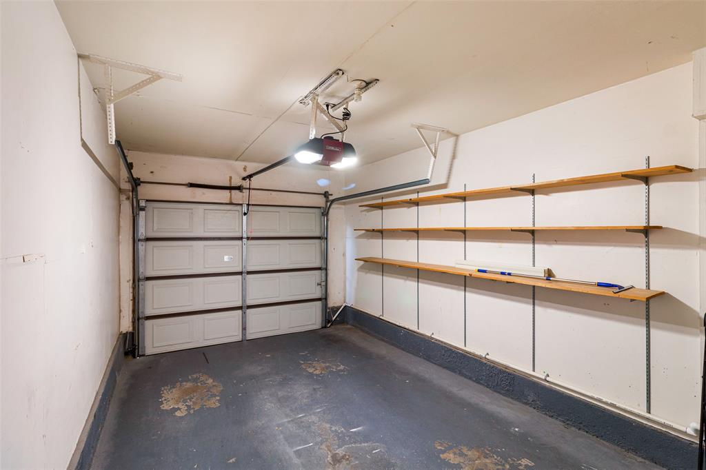 17490 Meandering Way, Unit 804 Dallas, TX 75252 - Photo 22 of 33 a view of a garage