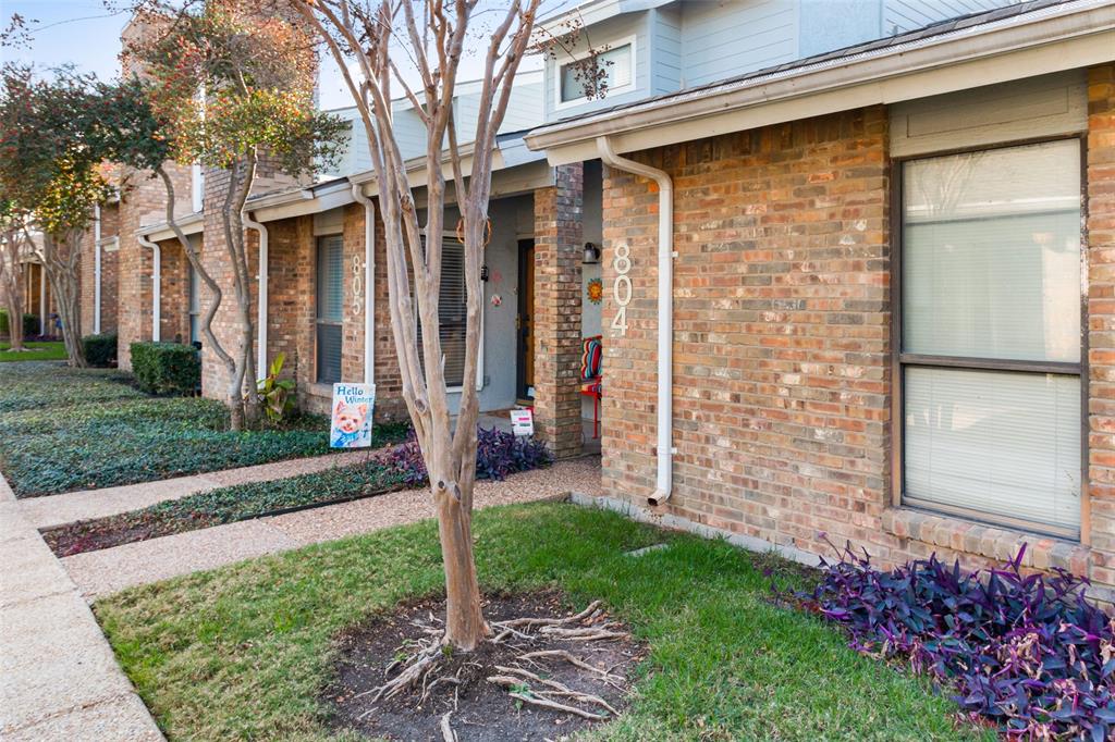 17490 Meandering Way, Unit 804 Dallas, TX 75252 - Photo 24 of 33 a front view of a house with a garden