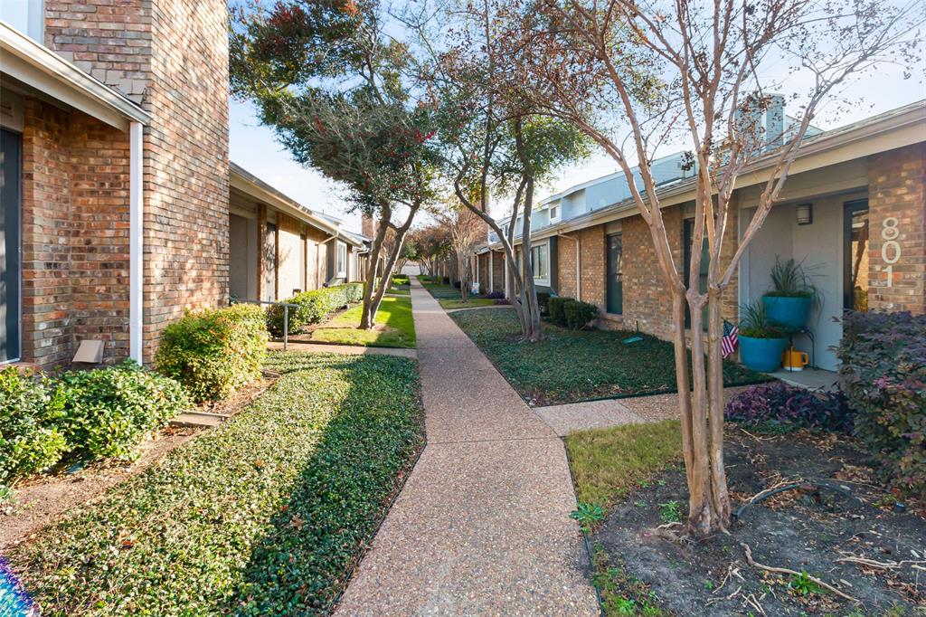 17490 Meandering Way, Unit 804 Dallas, TX 75252 - Photo 25 of 33 a front view of a house with a yard and trees