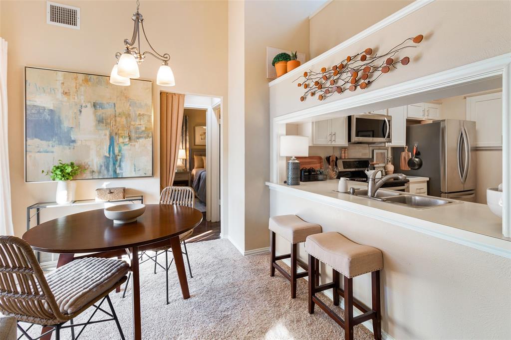 17490 Meandering Way, Unit 804 Dallas, TX 75252 - Photo 8 of 33 a dining room with furniture and window