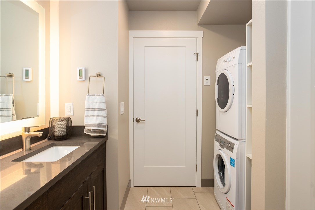 1880 Front Street, Unit 206 Lynden, WA 98264 - Photo 20 of 30 a view of bathroom with a sink mirror and shower