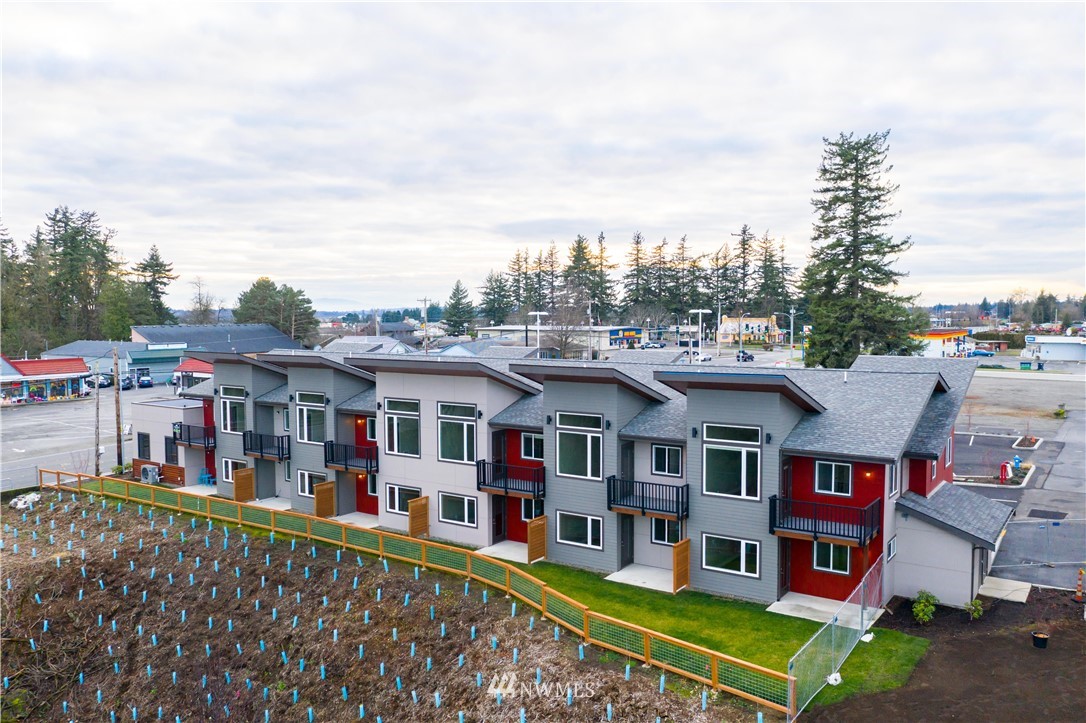 1880 Front Street, Unit 206 Lynden, WA 98264 - Photo 27 of 30 a view of multiple houses with a big yard