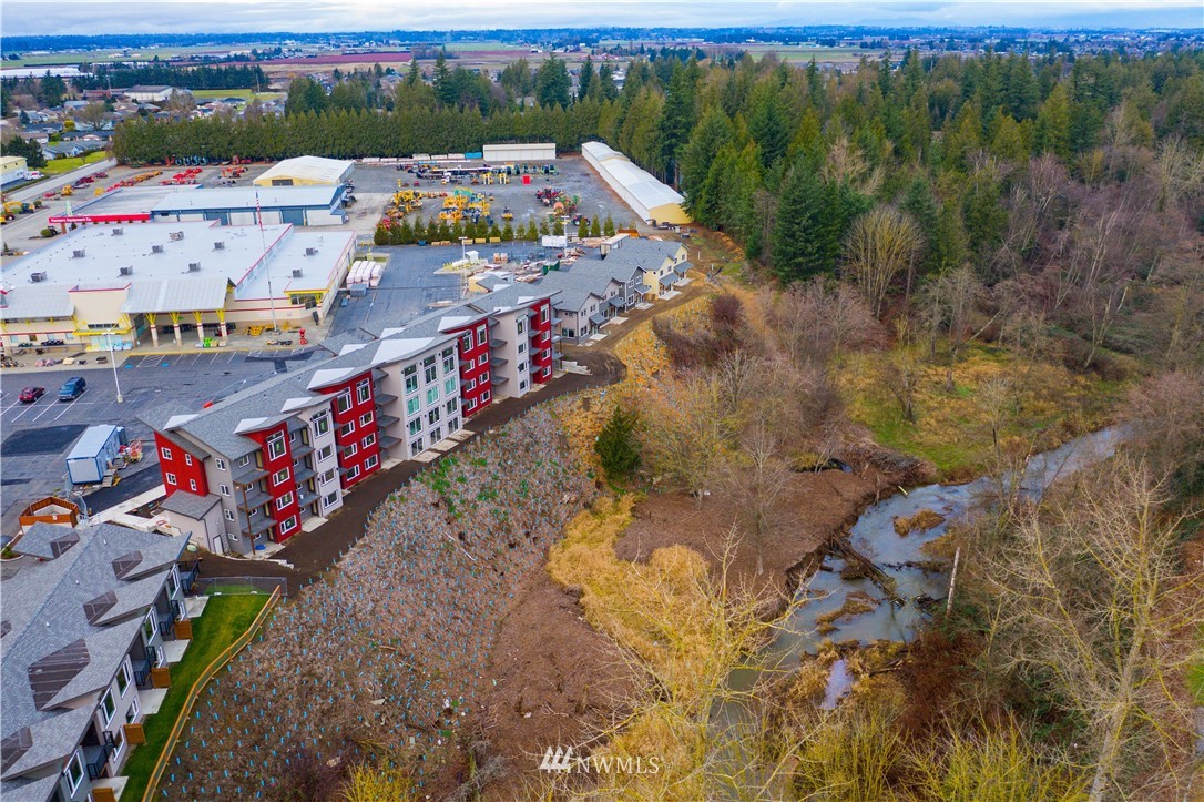 1880 Front Street, Unit 206 Lynden, WA 98264 - Photo 29 of 30 an aerial view of residential houses with outdoor space