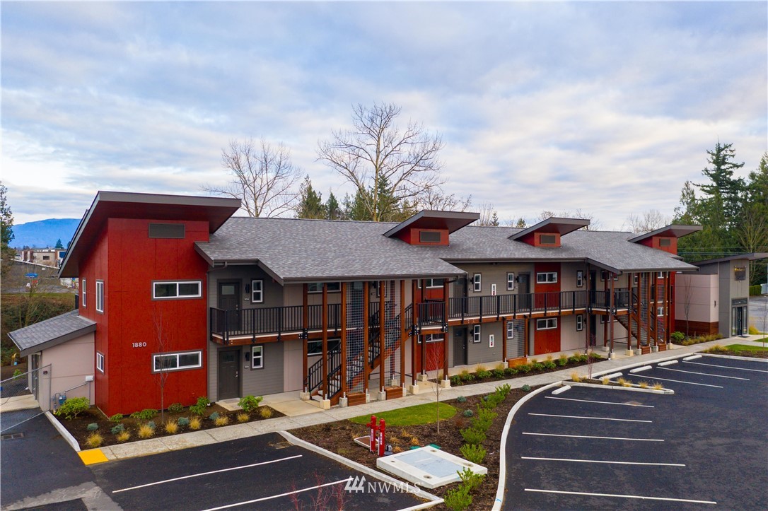 1880 Front Street, Unit 206 Lynden, WA 98264 - Photo 4 of 30 a view of a patio with couches chairs and wooden floor