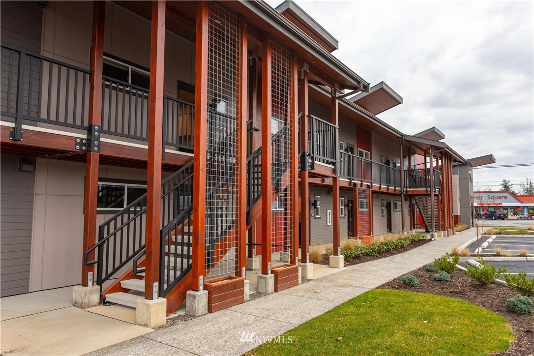 1880 Front Street, Unit 206 Lynden, WA 98264 - Photo 7 of 30 a view of a house with wooden fence