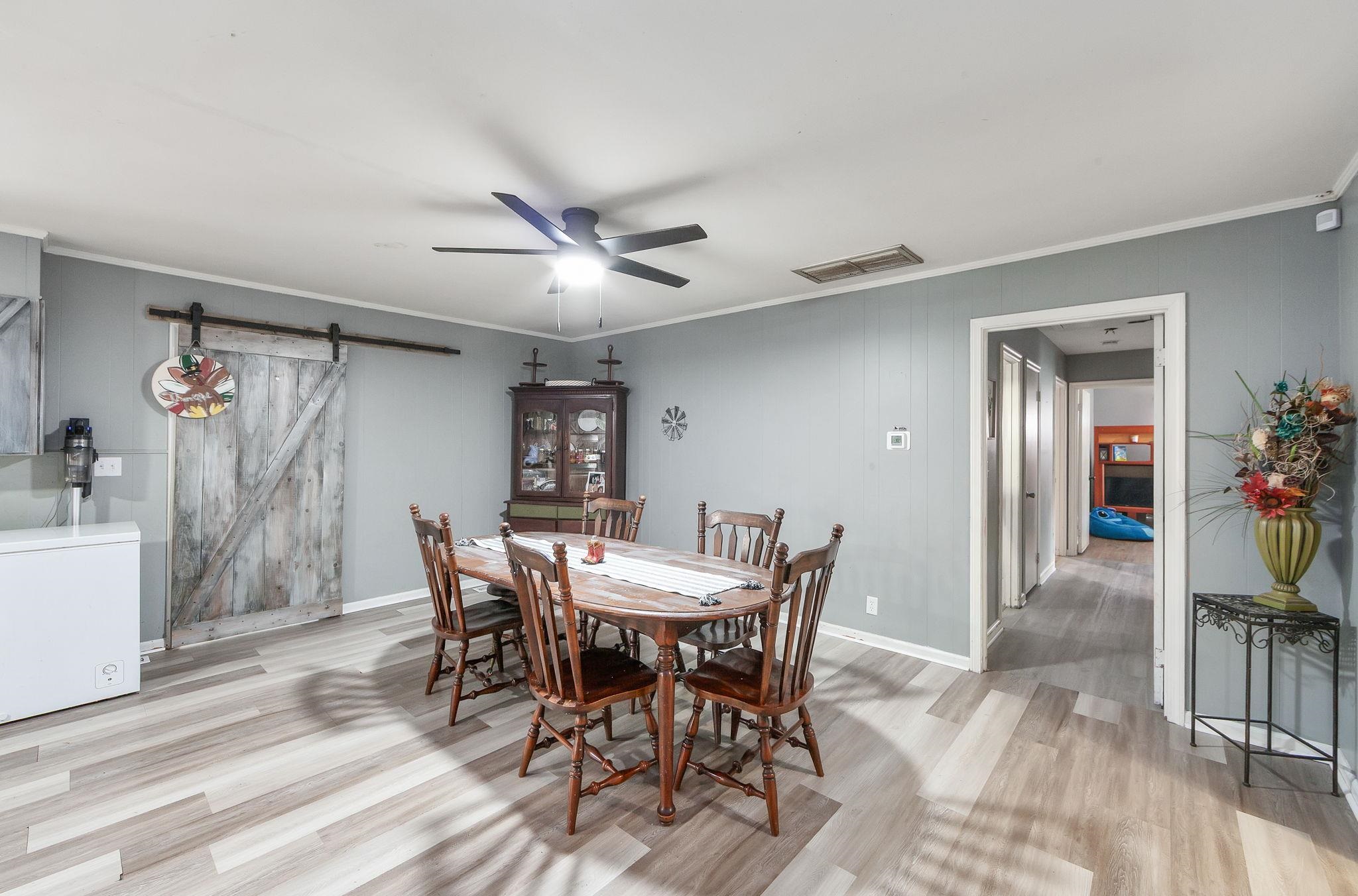 624 Ridgeway Drive Bolivar, TN 38008 - Photo 10 of 19 a view of a dining room with furniture and wooden floor