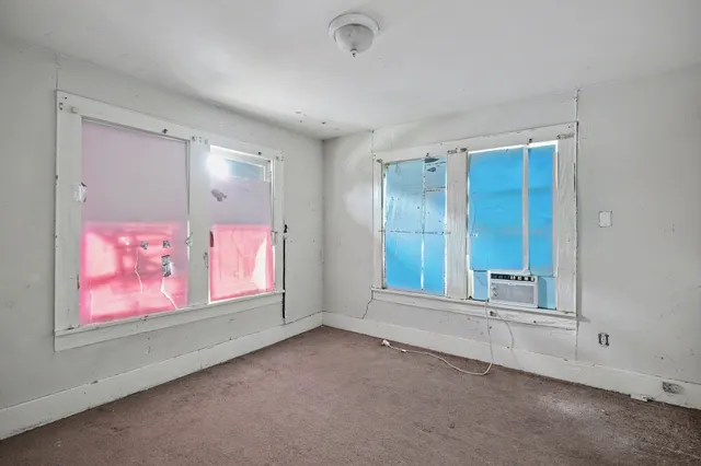 an empty room with windows