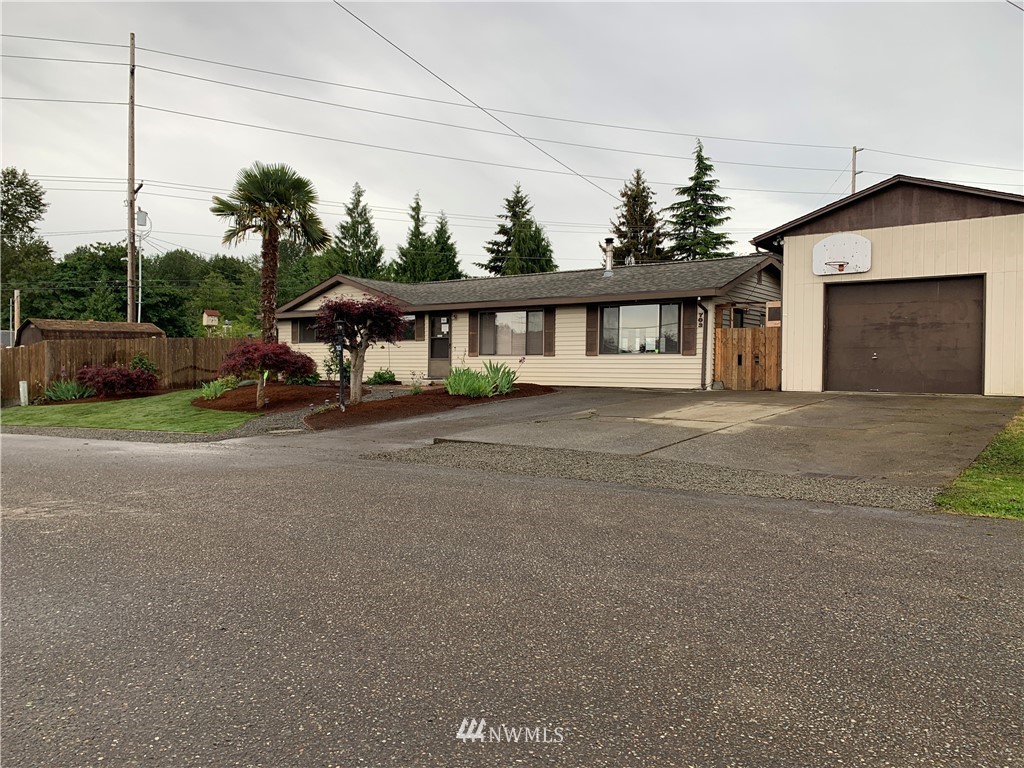 703 South 17th Street Renton, WA 98055 - Photo 2 of 20 a front view of a house with a yard and garage