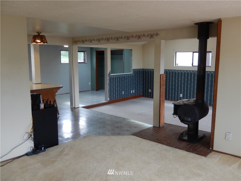 703 South 17th Street Renton, WA 98055 - Photo 16 of 20 a view of a hallway with entryway and wooden floor