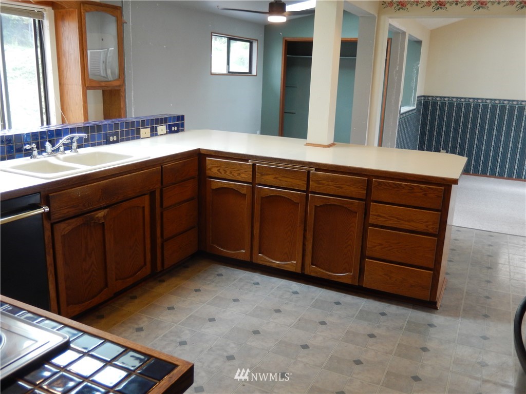 703 South 17th Street Renton, WA 98055 - Photo 9 of 20 a bathroom with a sink and a mirror