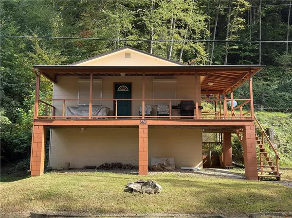 a front view of a house with garage