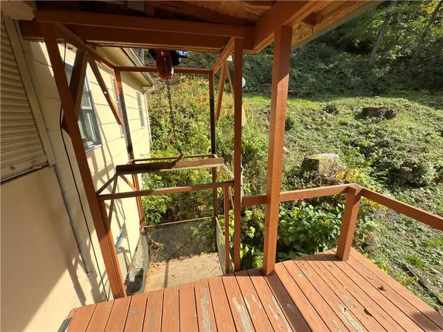 a view of balcony with wooden floor