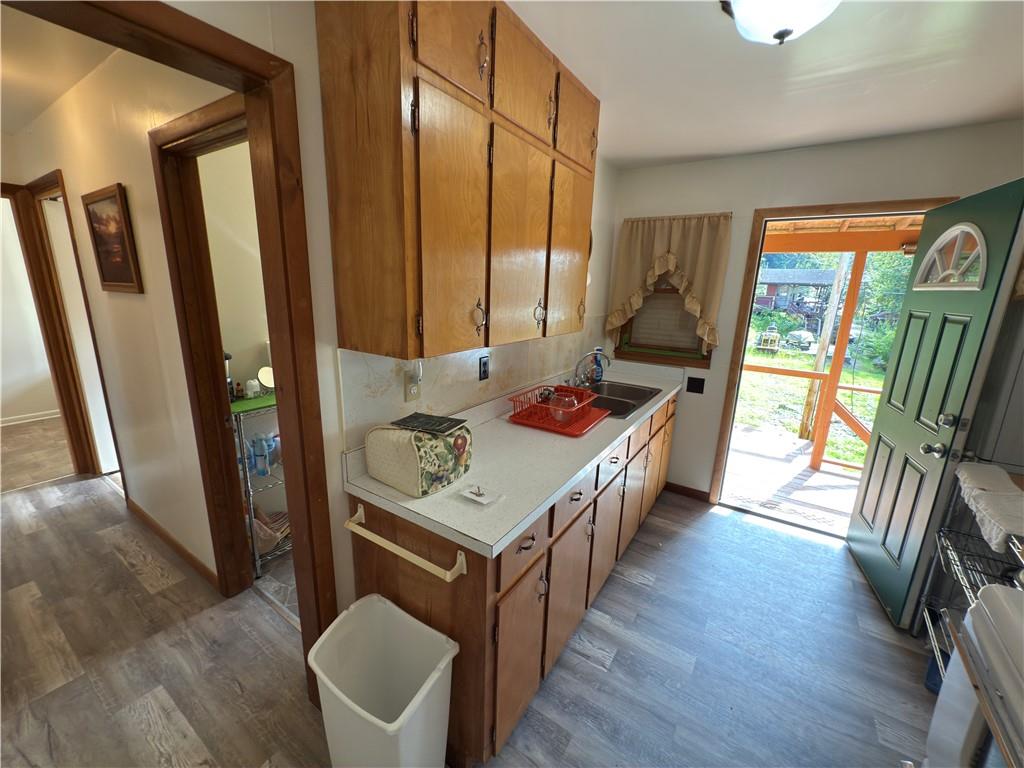 876 North Tunnel Road Kennerdell, PA 16374 - Photo 24 of 42 a kitchen with sink a stove and wood floor