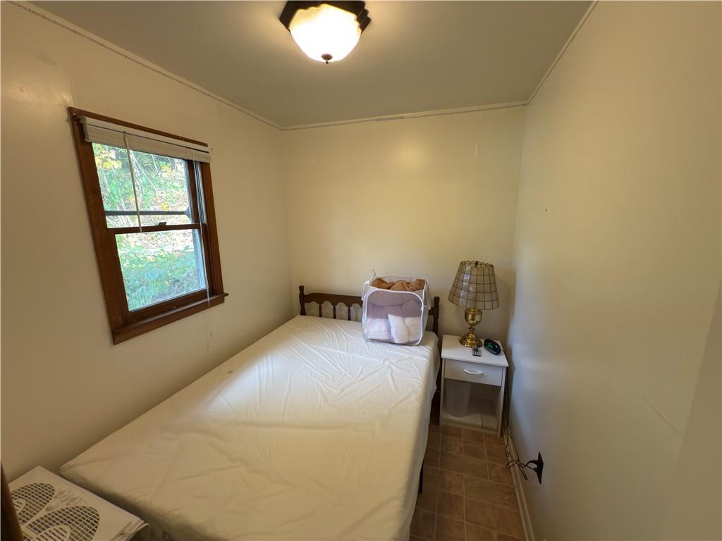 876 North Tunnel Road Kennerdell, PA 16374 - Photo 29 of 42 a bedroom with a bed and a window
