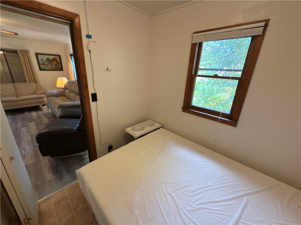 876 North Tunnel Road Kennerdell, PA 16374 - Photo 30 of 42 a bedroom with a bed and a window