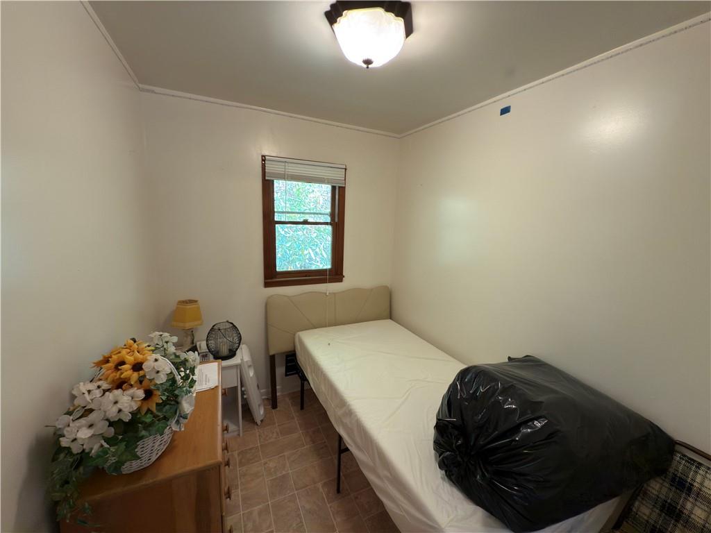 876 North Tunnel Road Kennerdell, PA 16374 - Photo 31 of 42 a bedroom with a bed and a chandelier