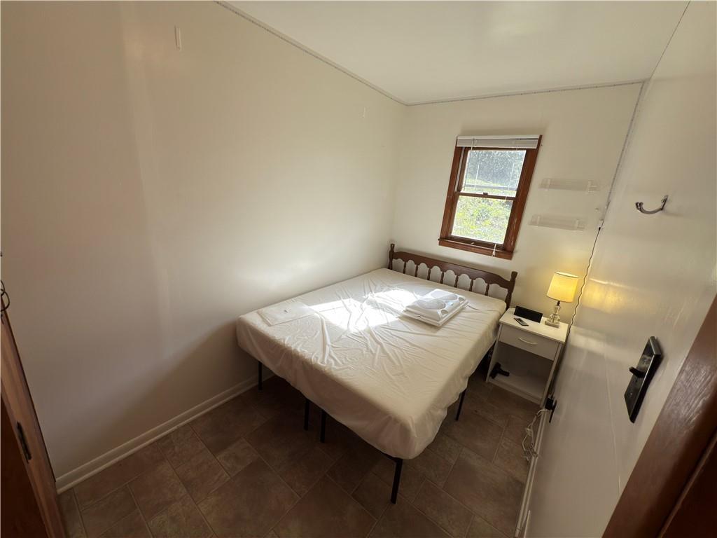 876 North Tunnel Road Kennerdell, PA 16374 - Photo 37 of 42 a bedroom with a bed and a mirror