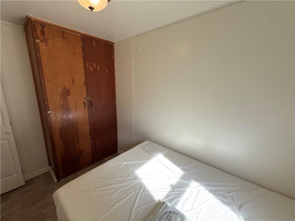 876 North Tunnel Road Kennerdell, PA 16374 - Photo 38 of 42 a bedroom with a bed and a mirror