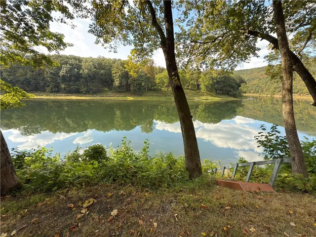 a view of lake with green space