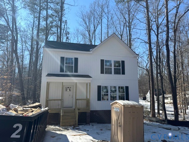 a front view of a house with yard seating
