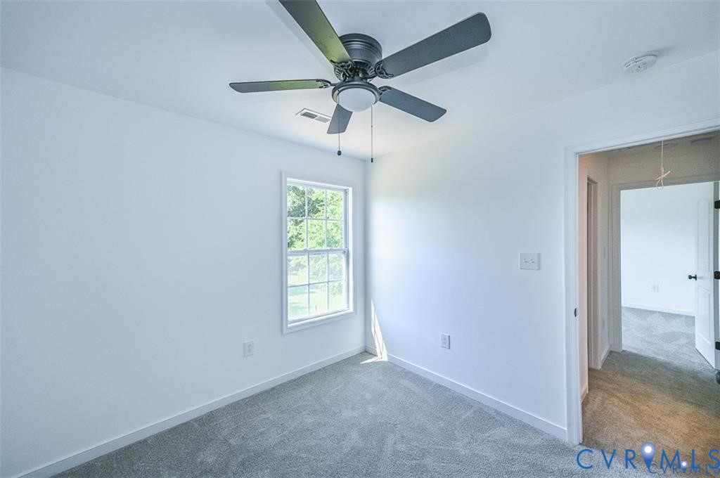 993 Swan Lane Ruther Glen, VA 22546 - Photo 17 of 31 an empty room with fan and windows