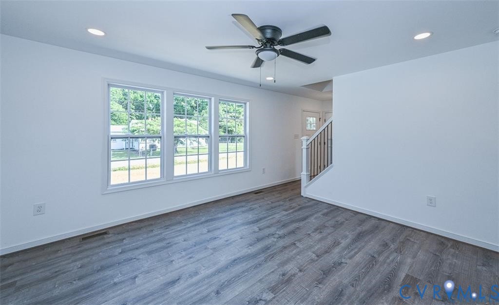 993 Swan Lane Ruther Glen, VA 22546 - Photo 3 of 31 a view of an empty room with a window and wooden floor