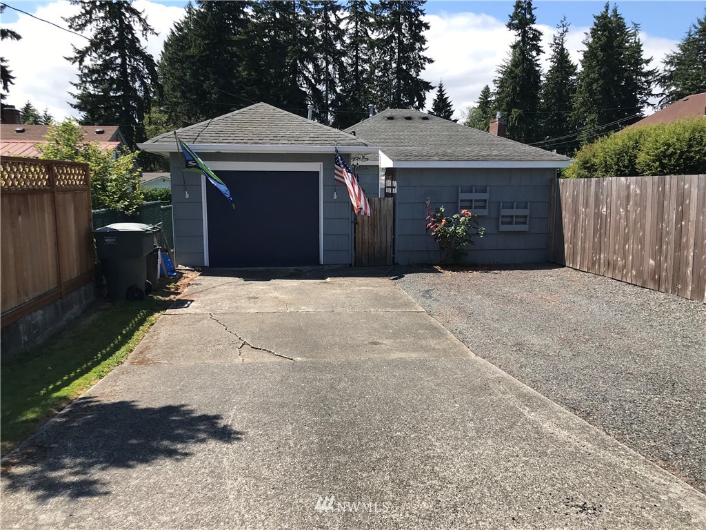 6525 Willow Road Everett, WA 98203 - Photo 22 of 22 a front view of a house with yard and trees