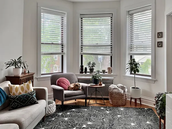 a living room with furniture and a large window