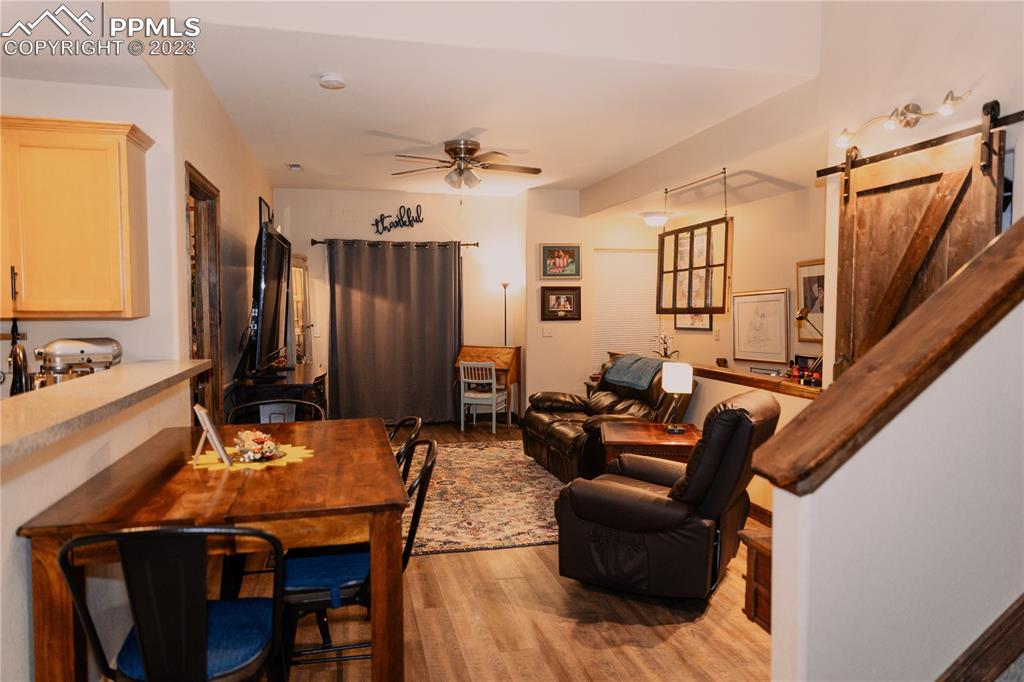 4848 Kerry Lynn View, Unit 202 Colorado Springs, CO 80922 - Photo 5 of 14 a living room with furniture and wooden floor