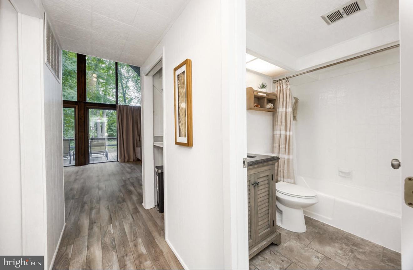 5 Falcon Bridge Road Ocean Pines, MD 21811 - Photo 24 of 59 a bathroom with a toilet sink and a mirror