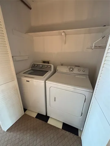 an empty room with wooden floor and closet