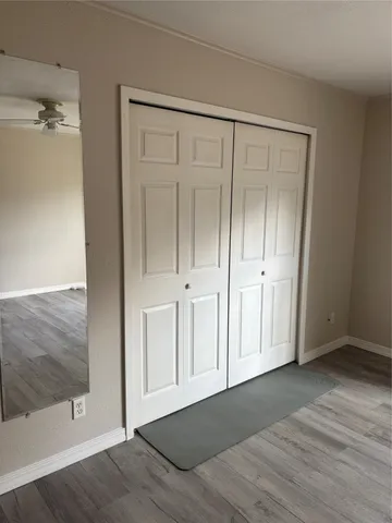 a view of an empty room with a window