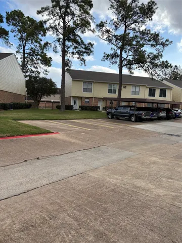 a view of a house with pool and a yard