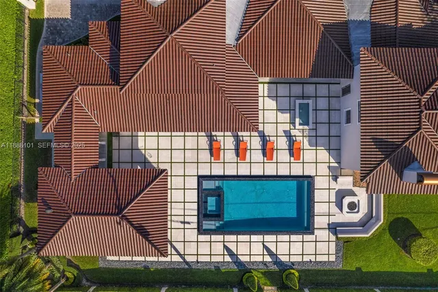 a en suite spacious bathroom with a granite countertop tub shower and mirror